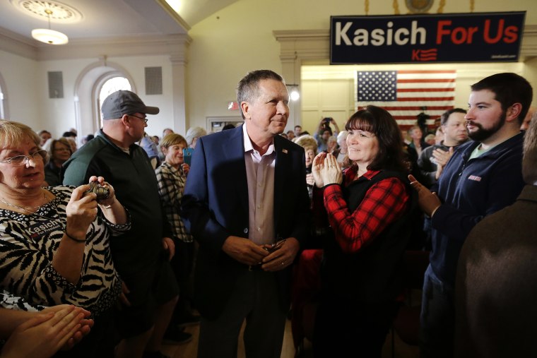 Republican presidential candidate, Ohio Gov. John Kasich, center, arrives at the start of a town hall campaign event, Feb. 29, 2016, in Plymouth, Mass. (Photo by Steven Senne/AP)