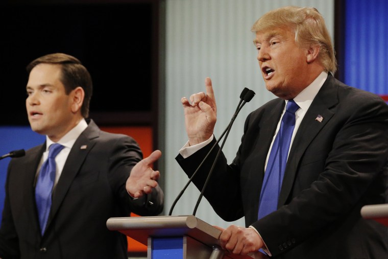 Republican presidential candidate Marco Rubio and rival candidate Donald Trump argue at the same time at the debate in Detroit, Mich., March 3, 2016. (Photo by Jim Young/Reuters)