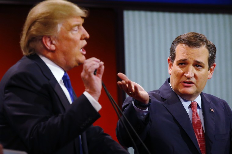 Republican presidential candidates, businessman Donald Trump and Sen. Ted Cruz (R-Texas), argue a point during a debate at Fox Theatre, March 3, 2016, in Detroit. (Photo by Paul Sancya/AP)