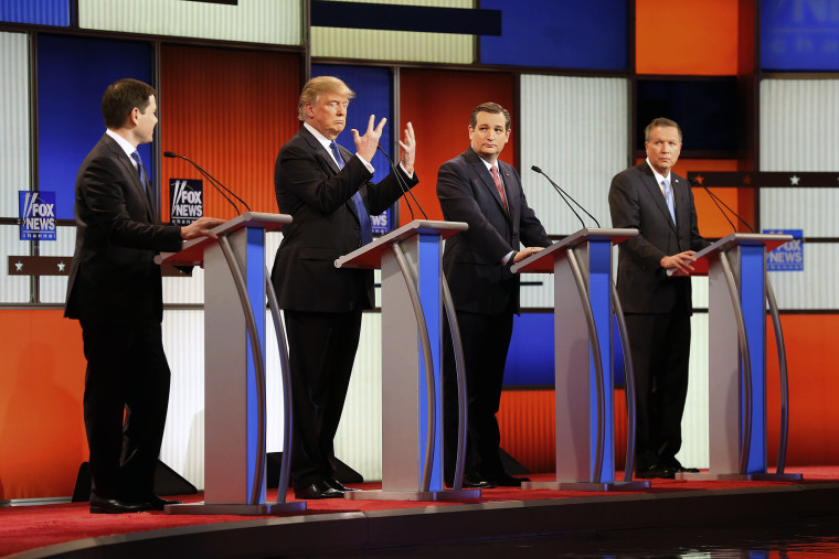 Republican presidential candidate Donald Trump, second from left, gestures as Sen. Marco Rubio, R-Fla., Sen. Ted Cruz, R-Texas, and Ohio Gov. John Kasich watch him during the a Republican presidential primary debate in Detroit. (Photo by Paul Sancya/AP)