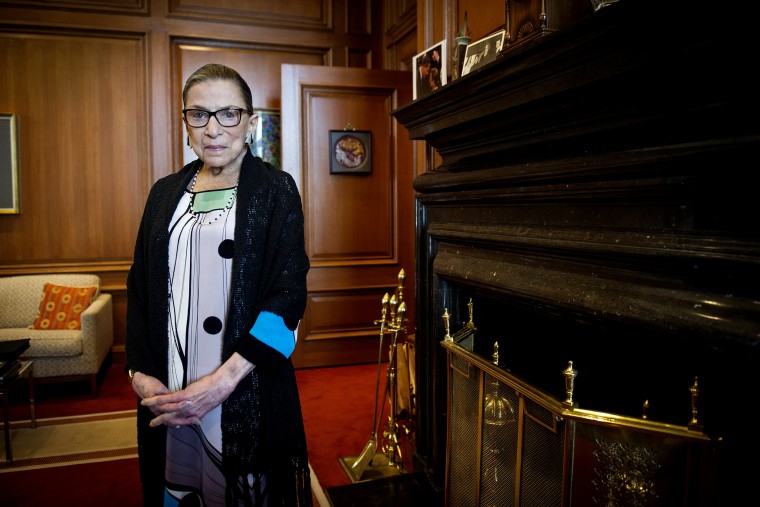 Associate Justice Ruth Bader Ginsburg poses in her Supreme Court chambers in Washington, July 31, 2014. (Photo by Cliff Owen/AP)