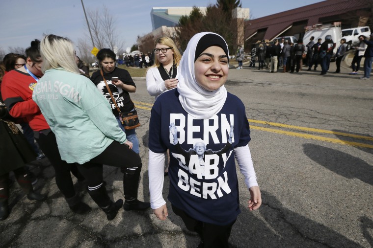 Wafa Berry of Dearborn, Mich., waits in line to enter a rally for Democratic presidential candidate, Sen. Bernie Sanders, I-Vt., March 7, 2016. (Photo by Charlie Neibergall/AP)