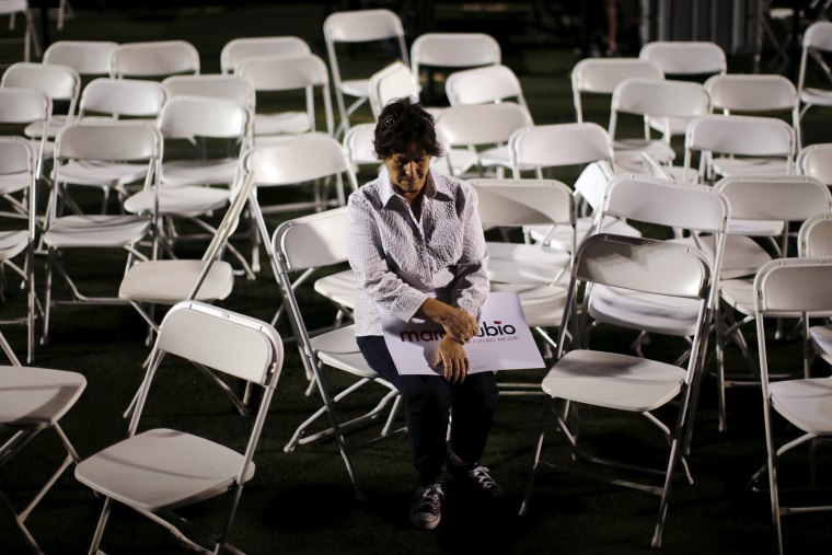 A supporter of Republican presidential candidate Marco Rubio sits by herself after a campaign rally in Miami, Fla., March 9, 2016. (Photo by Carlos Barria/Reuters)