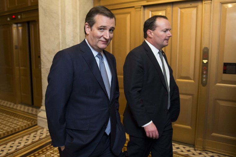 Presidential candidate Sen. Ted Cruz speaks with Sen. Mike Lee, R-Utah, as they leave the Senate floor following the cloture vote on the \"American Security Against Foreign Enemies Act of 2015\" on Jan. 20, 2016. (Photo By Bill Clark/CQ Roll Call/AP)