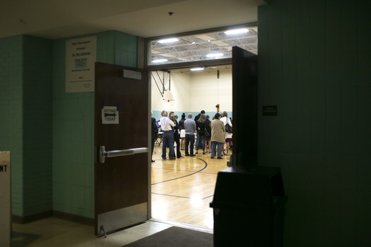 In the early morning hours, voters wait in line to cast ballots at a polling station in Schiller Park Recreation Center in Columbus, Ohio, March 15, 2016. (Photo by Maddie McGarvey/The New York Times/Redux)