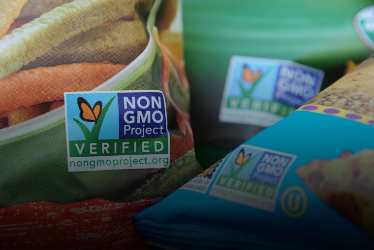 Labels on bags of snack foods indicate they are non-GMO food products, in Los Angeles, Calif. (Photo by Robyn Beck/AFP/Getty)