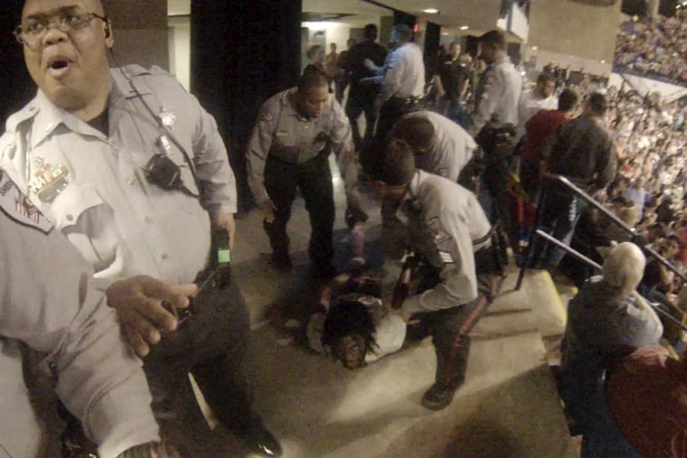Rakeem Jones lies on the ground while being removed by deputies from a Donald Trump rally in Fayetteville, N.C., March 9, 2016. (Photo by Handout/Reuters)