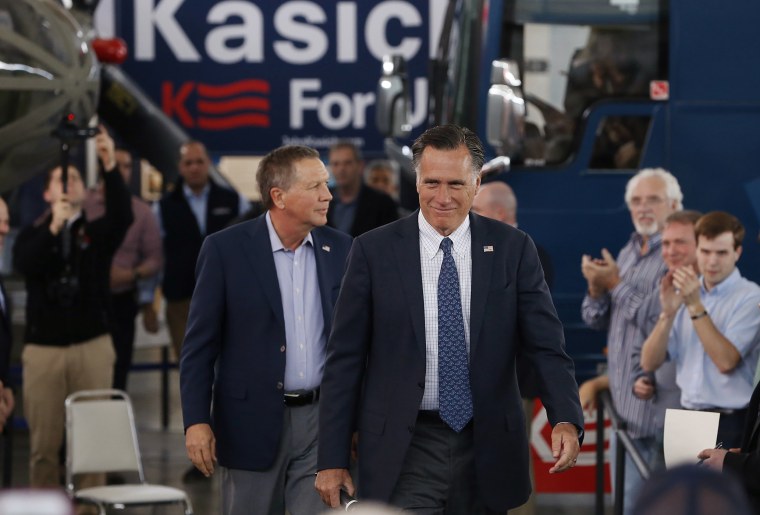 Former Republican U.S. presidential nominee Mitt Romney arrives with current Republican presidential candidate John Kasich inside the MAPS Air Museum for a Kasich campaign rally in North Canton, Ohio, March 14, 2016. (Photo by Aaron P. Bernstein/Reuters)