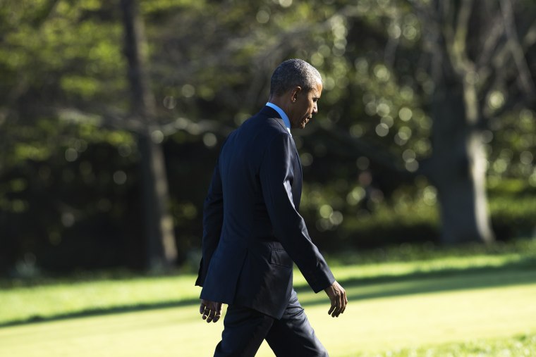 President Barack Obama walks across the South Lawn after arriving on Marine One at the White House in Washington, D.C., March 29, 2016. (Photo by Saul Loeb/AFP/Getty)