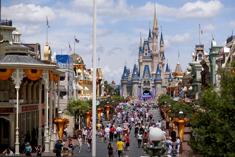 Visitors make their way toward Cinderella Castle at Magic Kingdom, at the Walt Disney World theme park and resort in Lake Buena Vista, Florida.  (Photo by Matt Stroshane/Bloomberg/Getty)