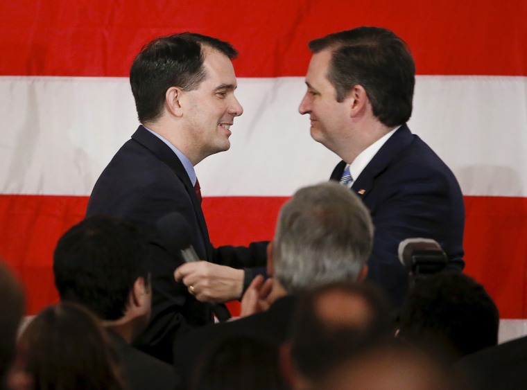 Wisconsin Governor Scott Walker greets on stage presidential candidate Ted Cruz during Milwaukee County GOP's 'Wisconsin Decides 2016' presidential candidate event at the American Serb Banquet Hall, April 1, 2016. (Photo by Kamil Krzaczynski/Reuters)