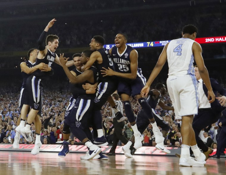 Villanova players celebrate after the NCAA Final Four tournament college basketball championship game against North Carolina, Monday, April 4, 2016, in Houston. (Photo by David J. Phillip/AP)