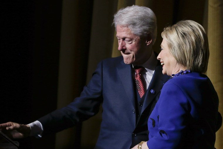 Former President Bill Clinton makes way for Democratic presidential candidate Hillary Clinton during the \"Hillary Victory Fund: I'm with Her\" benefit concert, March 2, 2016, in New York. (Photo by Julie Jacobson/AP)