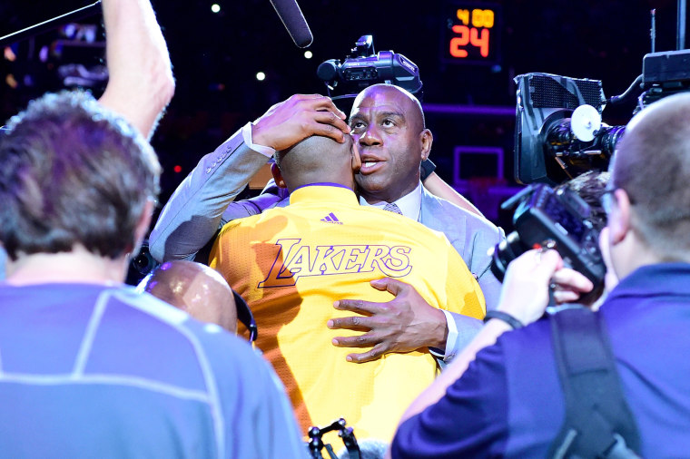 Earvin 'Magic' Johnson hugs Kobe Bryant #24 of the Los Angeles Lakers before the game against the Utah Jazz at Staples Center on April 13, 2016 in Los Angeles, Calif. (Photo by Harry How/Getty)