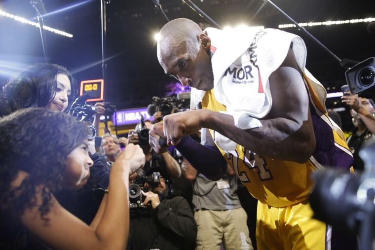 Los Angeles Lakers' Kobe Bryant, right, fist-bumps his daughter Gianna after the last NBA basketball game of his career, against the Utah Jazz on April 13, 2016, in Los Angeles, Calif. (Photo by Jae C. Hong/AP)