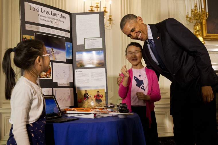 Barack Obama, Rebecca Yeung, Kimberly Yeung (Photo by Jacquelyn Martin/AP)