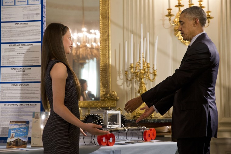 Hannah Herbst, 15, of Boca Raton, Fla., shows her invention, BEACON, an ocean-energy probe prototype to President Barack Obama during the 2016 White House Science Fair in the State Dining Room of the White House in Washington(Photo by Jacquelyn Martin/AP)