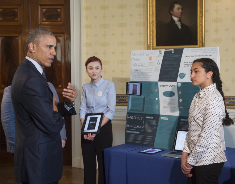 President Barack Obama speaks with students that created an Android app called Spectrum that provides a social media network for the LGBT community as he tours the 2016 White House Science Fair in the Blue Room at the White House in Washington, D.C., Apri