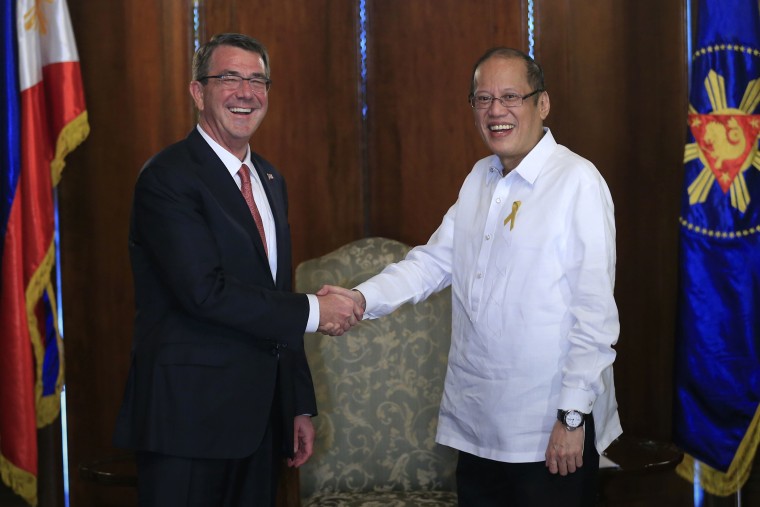 Philippine President Benigno Aquino III, right, greets Defense Secretary Ash Carter during his courtesy call at the Malacanang presidential palace in Manila, Philippines on April 14, 2016. (Photo by Romeo Ranoco/AP)