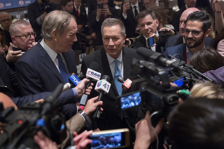 John Kasich, 2016 Republican presidential candidate, speaks to members of the media next to George Pataki, former governor of New York, during the New York State Republican Gala, April 14, 2016. (Photo by Victor J. Blue/Bloomberg/Getty)