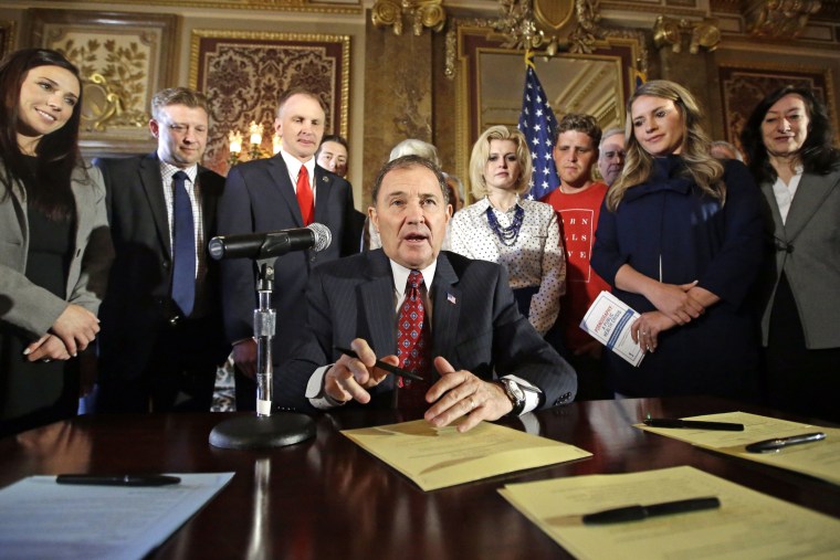 Utah Gov. Gary Herbert looks up during a ceremonial signing of a state resolution declaring pornography a public health crisis, April 19, 2016, in Salt Lake City. (Photo by Rick Bowmer/AP)