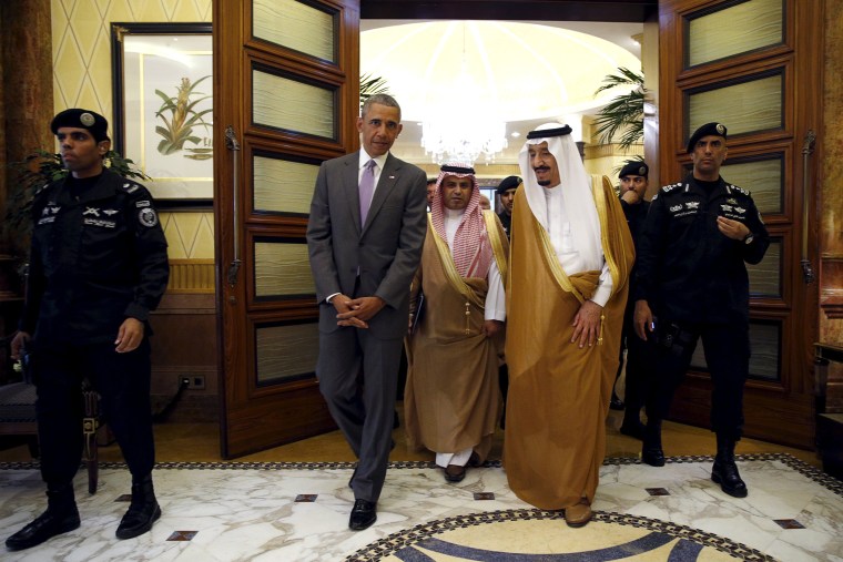 President Barack Obama walks with Saudi King Salman at Erga Palace upon his arrival for a summit meeting in Riyadh, Saudi Arabia, April 20, 2016. (Photo by Kevin Lamarque/Reuters)