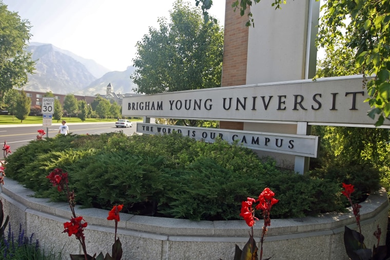 Cars and people make their way past the enterance of Brigham Young University in Provo, Utah. (Photo by George Frey/Bloomberg/Getty)