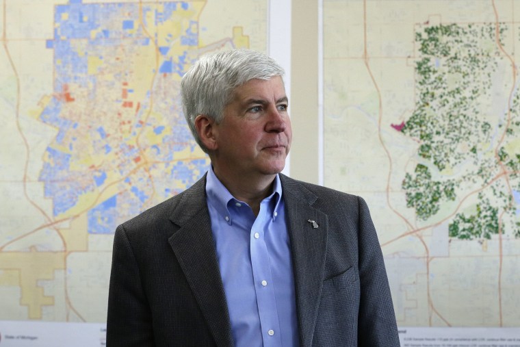 In this Feb. 18, 2016 file photo, Gov. Rick Snyder addresses the media in Flint, Mich. (Photo by Carlos Osorio/AP)