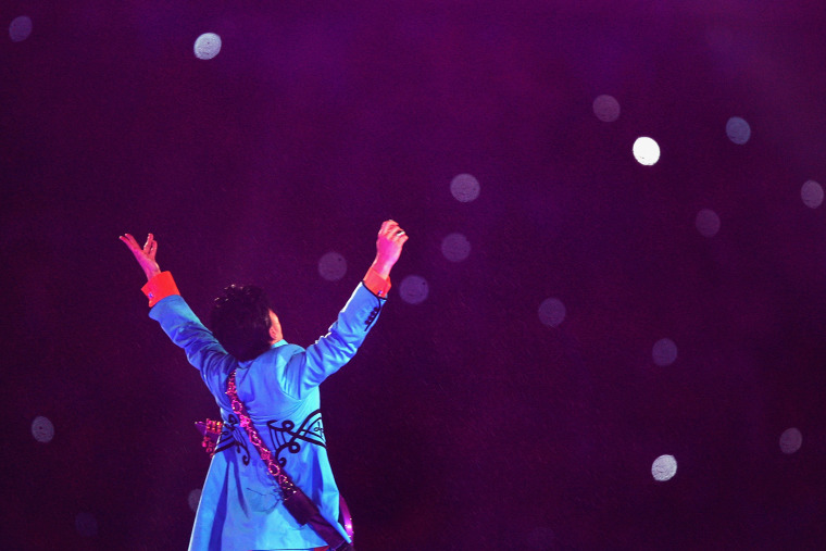 Musician Prince performs during the \"Pepsi Halftime Show\" at Super Bowl XLI between the Indianapolis Colts and the Chicago Bears on Feb. 4, 2007 at Dolphin Stadium in Miami Gardens, Fla. (Photo by Jed Jacobsohn/Getty)