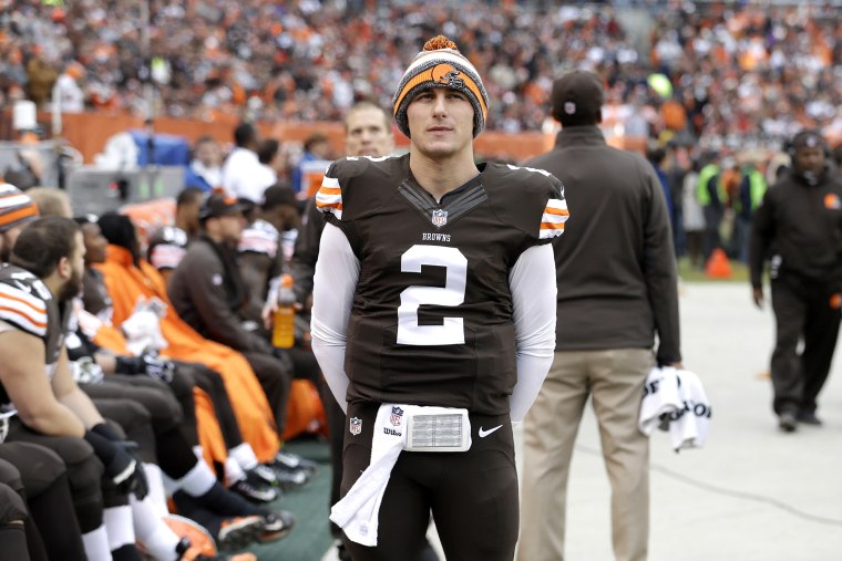 Cleveland Browns quarterback Johnny Manziel (2) watches from the sidelines in the first quarter of an NFL football game against the Cincinnati Bengals, Dec. 14, 2014, in Cleveland, Ohio. (Photo by Tony Dejak/AP)