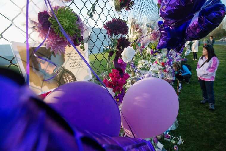 Mementos left by fans are attached to the fence which surrounds Paisley Park, the home and studio of Prince, on April 23, 2016 in Chanhassen, Minn. (Photo by Scott Olson/Getty)