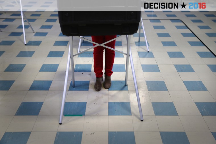 A voter fills out her ballot at a polling center on April 26, 2016 in Stamford, Conn. (Photo by John Moore/Getty)