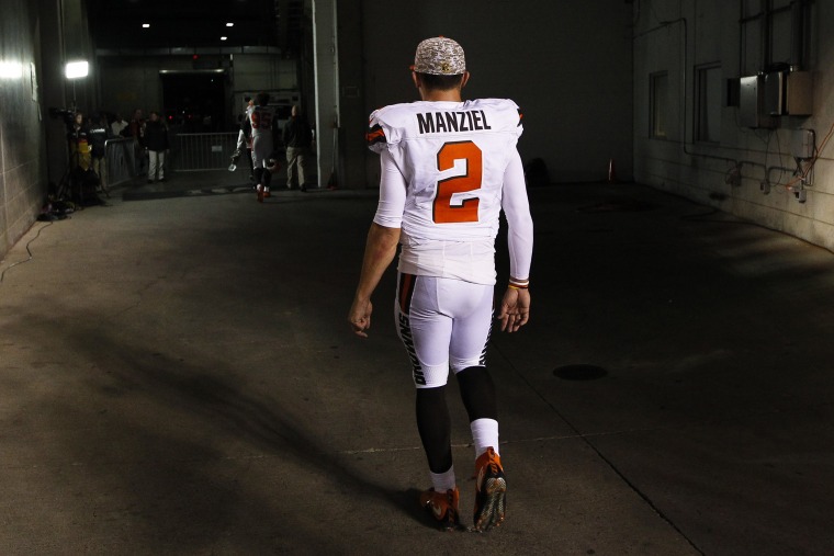 In this Nov. 5, 2015, file photo, Cleveland Browns quarterback Johnny Manziel walks off the field after an 31-10 loss to the Cincinnati Bengals, in Cincinnati. (Photo by Frank Victores/AP)