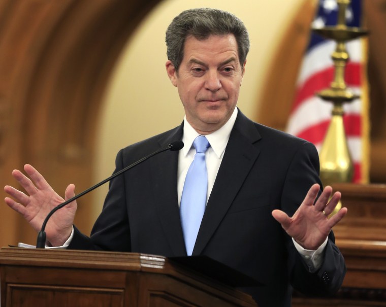 In this Jan. 12, 2016 file photo, Kansas Gov. Sam Brownback speaks to the legislature in Topeka, Kan. (Photo by Orlin Wagner/AP)