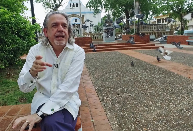 Lin-Manuel Miranda's father, Luis Miranda, sits in the town square, or \"placita\" in his hometown of Vega Alta, Puerto Rico. Like many, he is extremely worried about the island's spiraling economic crisis.