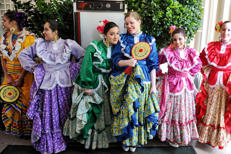 Dancers of the Ballet Folklorico Mexicano wait to perform during a Cinco de Mayo reception in the Rose Garden at the White House on May 3, 2012 in Washington, D.C. (Photo by Olivier Douliery/Getty)