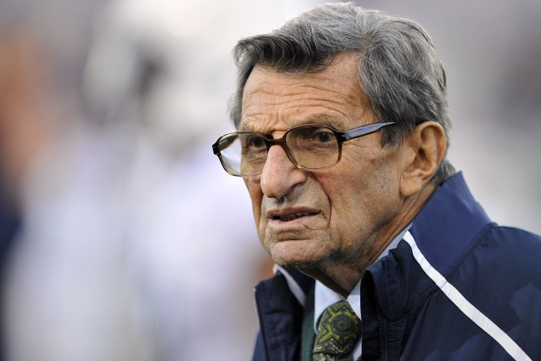 In this Oct. 22, 2011 file photo, Penn State coach Joe Paterno stands on the field before his team's NCAA college football game against Northwestern, in Evanston, Ill. (Photo by Jim Prisching/AP)