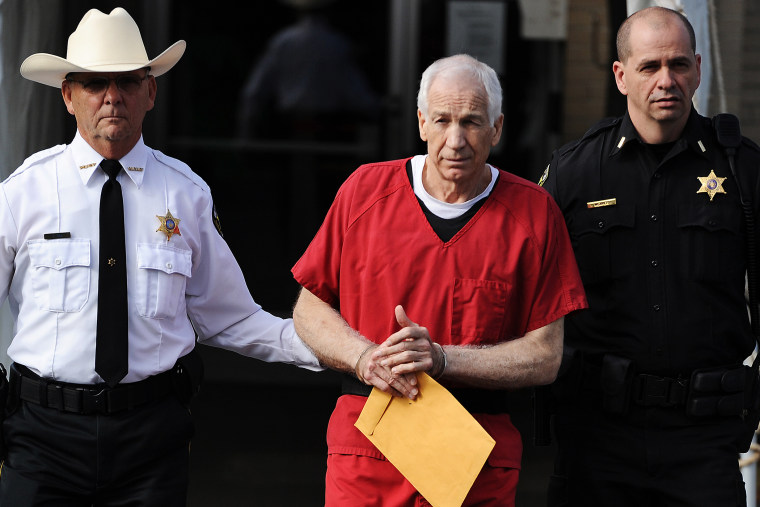 Former Penn State assistant football coach Jerry Sandusky leaves the Centre County Courthouse after being sentenced in his child sex abuse case on Oct. 9, 2012 in Bellefonte, Penn. (Photo by Patrick Smith/Getty)