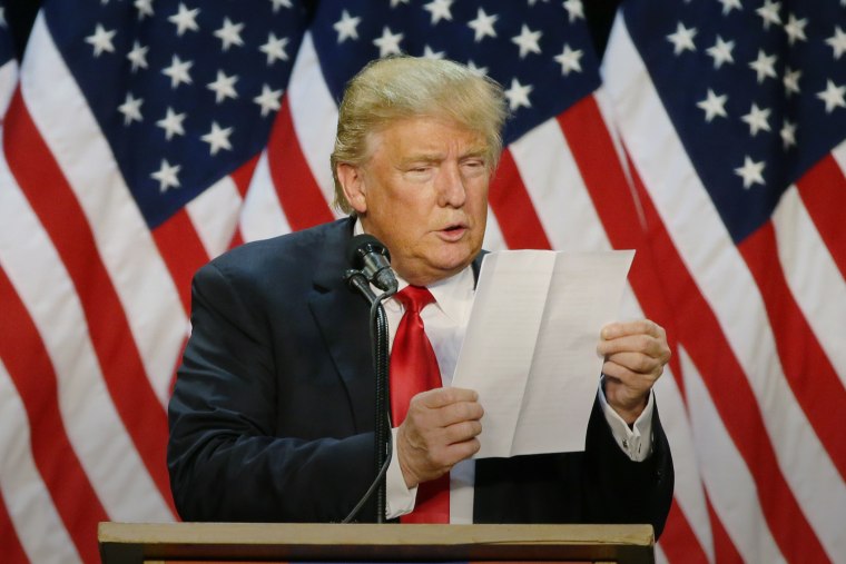 Republican presidential candidate Donald Trump looks at a sheet of notes and talking points as he speaks during a rally in Eugene, Ore., May 6, 2016. (Photo by Ted S. Warren/AP)
