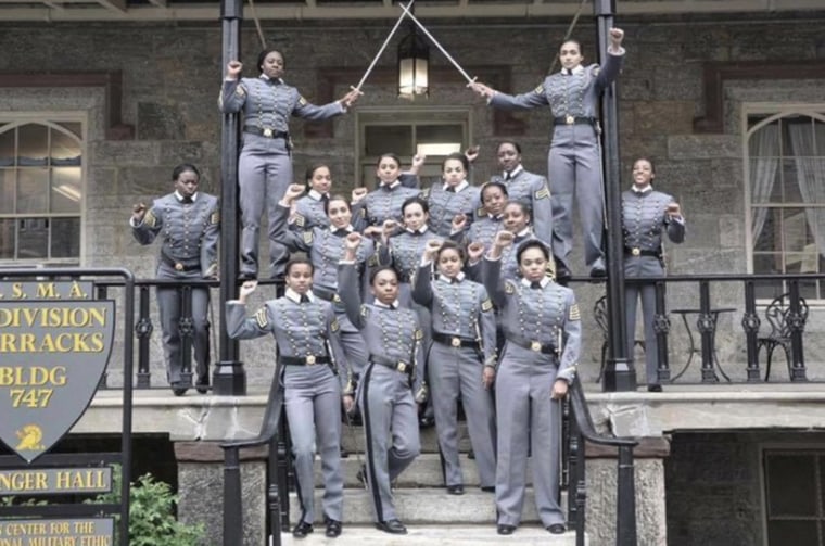 This undated image obtained from Twitter on May 7, 2016 shows 16 black, female cadets in uniform with their fists raised while posing for a photograph at the United States Military Academy at West Point, N.Y. (Photo obtained from Twitter/AP)