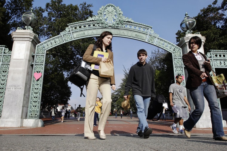 University of California Berkeley students walk through Sather Gate on the campus in Berkeley, Calif. (Photo by Paul Sakuma/AP)