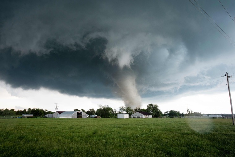A tornado rips through a residential area after touching down south of Wynnewood, Okla., on May 09, 2016. (Photo by Josh EdelsonAFP/Getty)