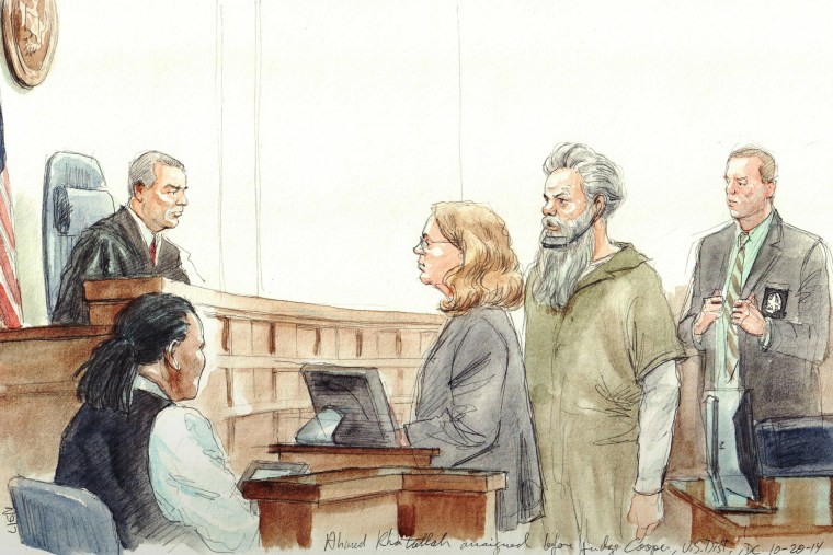 Ahmed Abu Khatallah arraigned before US Dist. judge Christopher R Cooper. Defense attny. Michelle Peterson at lectern in 2014. (Arthur Lien)