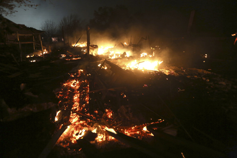 The remains of a home burn early in the morning on April 18, 2013, after a fertilizer plant exploded in West, Texas. (Photo by LM Otero/AP)
