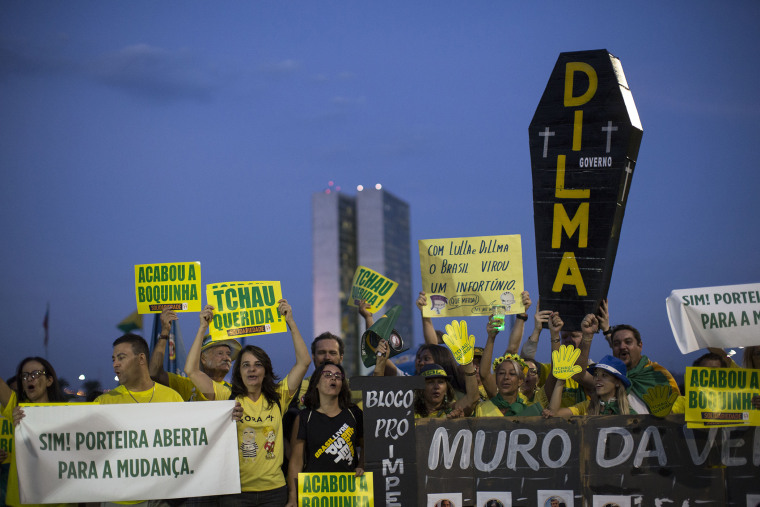 Anti-government demonstrators gather outside Congress in Brasilia, Brazil, Wednesday, May 11, 2016. (Photo by Felipe Dana/AP)