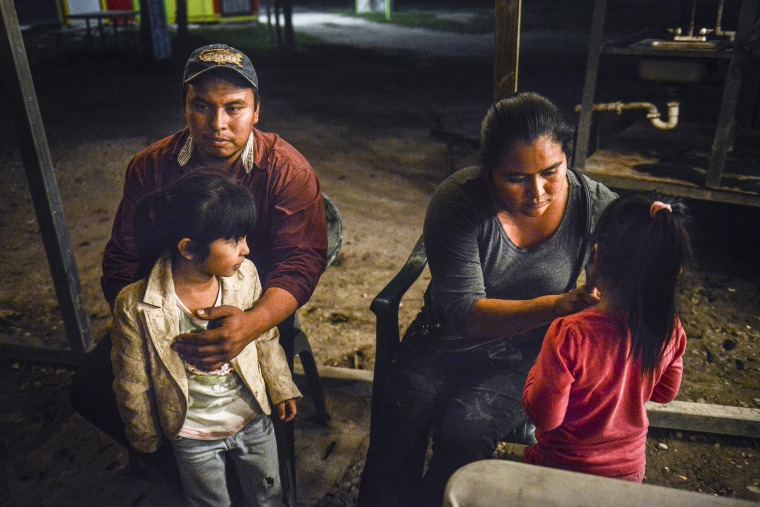 Ramiro Beltran and his wife Alma Hernandez Beltran, both undocumented immigrants, sit with their daughters who are U.S. citizens, Kimberly Beltran and Kayla Beltran, in Alamo, Texas, Nov. 24, 2014. (Photo by Matthew Busch for The Washington Post/Getty)