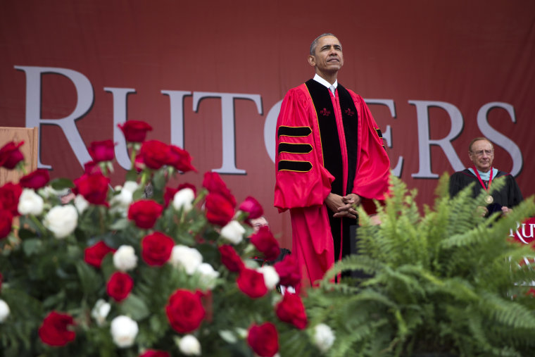 President Barack Obama listens during Rutgers University's 250th Anniversary commencement ceremony, on May 15, 2016, in Piscataway, N.J. (Photo by Evan Vucci/AP)