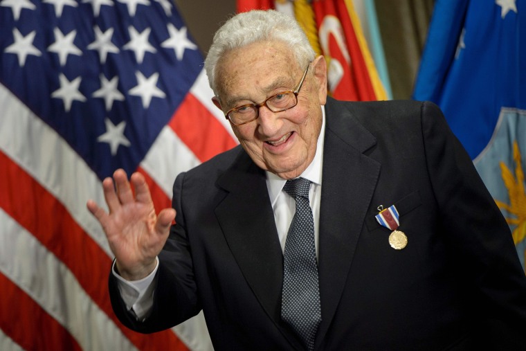 Former Secretary of State Henry Kissinger waves after receiving an award during a ceremony at the Pentagon honoring his diplomatic career May 9, 2016 in Washington, DC. (Photo by Brendan Smialowski/AFP/Getty)