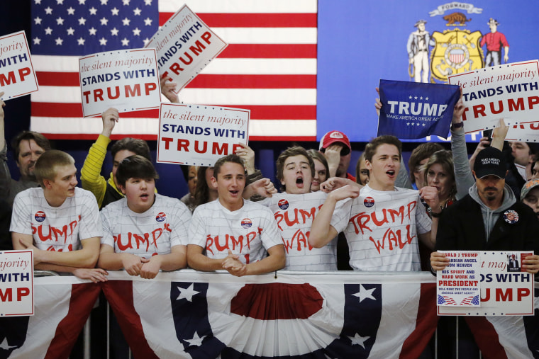 Supporters of Republican presidential candidate, Donald Trump, chant, \"Build That Wall,\" before a town hall, April 2, 2016, in Rothschild, Wis. (Photo by Charles Rex Arbogast/AP)
