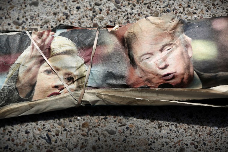 A rubber band wraps the front page of La Opinion newspaper featuring pictures of Democratic Presidential Candidate Hillary Clinton and Republican Presidential Candidate Donald Trump in Santa Ana, Calif., May 15, 2016. (Photo by Patrick T. Fallon/Reuters)
